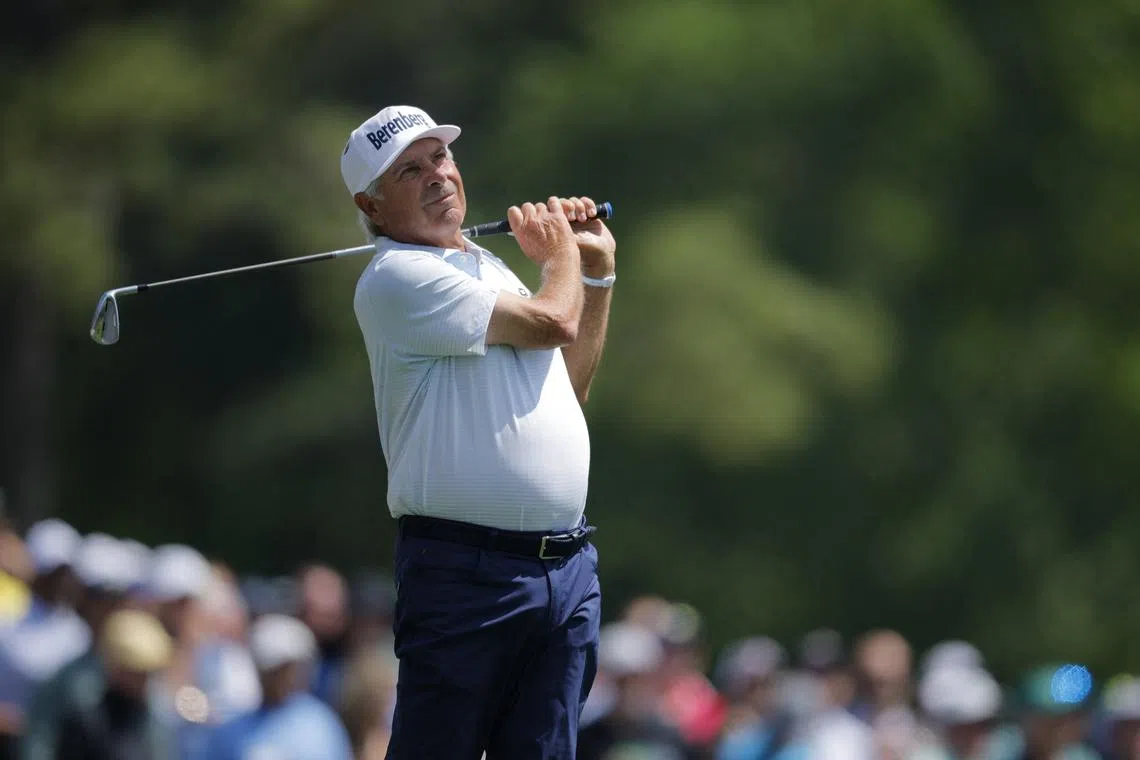 Golf - The Masters - Augusta National Golf Club, Augusta, Georgia, U.S. - April 10, 2025 Fred Couples of the U.S. watches his tee shot on the 12th hole during the first round REUTERS/Mike Blake