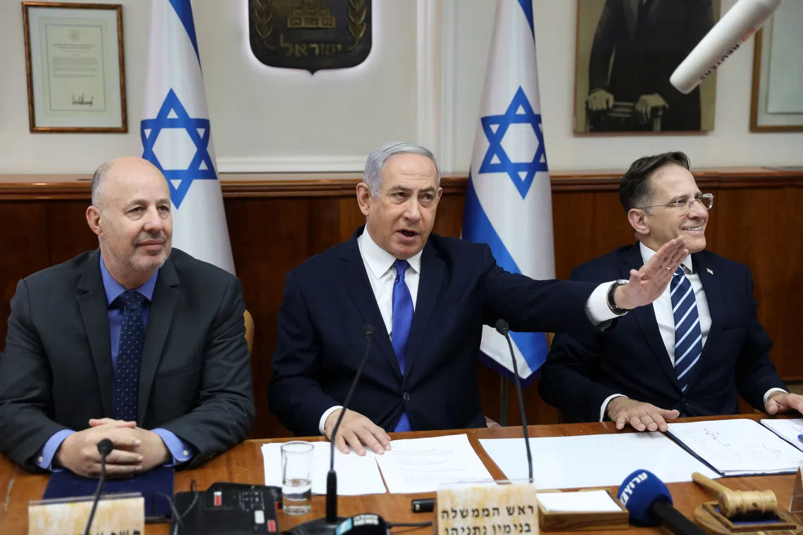 Israeli Prime Minister Benjamin Netanyahu (centre), Minister of Regional Cooperation Tzachi Hanegbi (left) and Cabinet Secretary Tzahi Braverman at a Cabinet meeting in Jerusalem, Israel, on Dec 29, 2019.