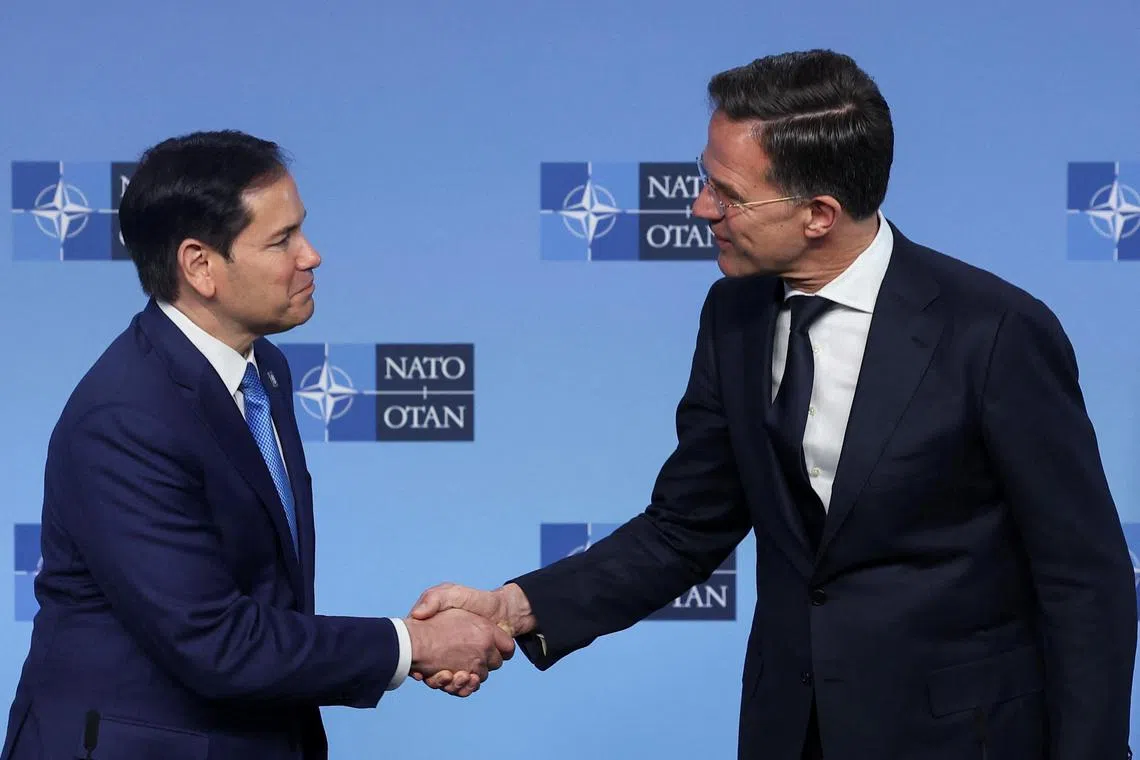 Nato secretary general Mark Rutte and US Secretary of State Marco Rubio shake hands on the day of a Nato foreign ministers' meeting at the alliance's headquarters in Brussels, Belgium, on April 3.