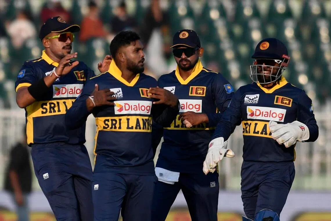 Sri Lanka's Wanindu Hasaranga (centre) and teammates celebrate after the dismissal of Pakistan's Mohammad Rizwan during the first one day international cricket match between Pakistan and Sri Lanka, in Rawalpindi, on Nov 11.