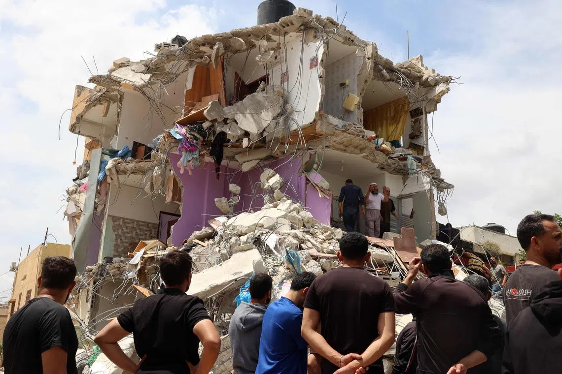 People check the devastation in a house after Israeli troops surrounded it and reportedly killed five people who were inside, during an army raid on Tamoun in the occupied West Bank on May 15, 2025. 