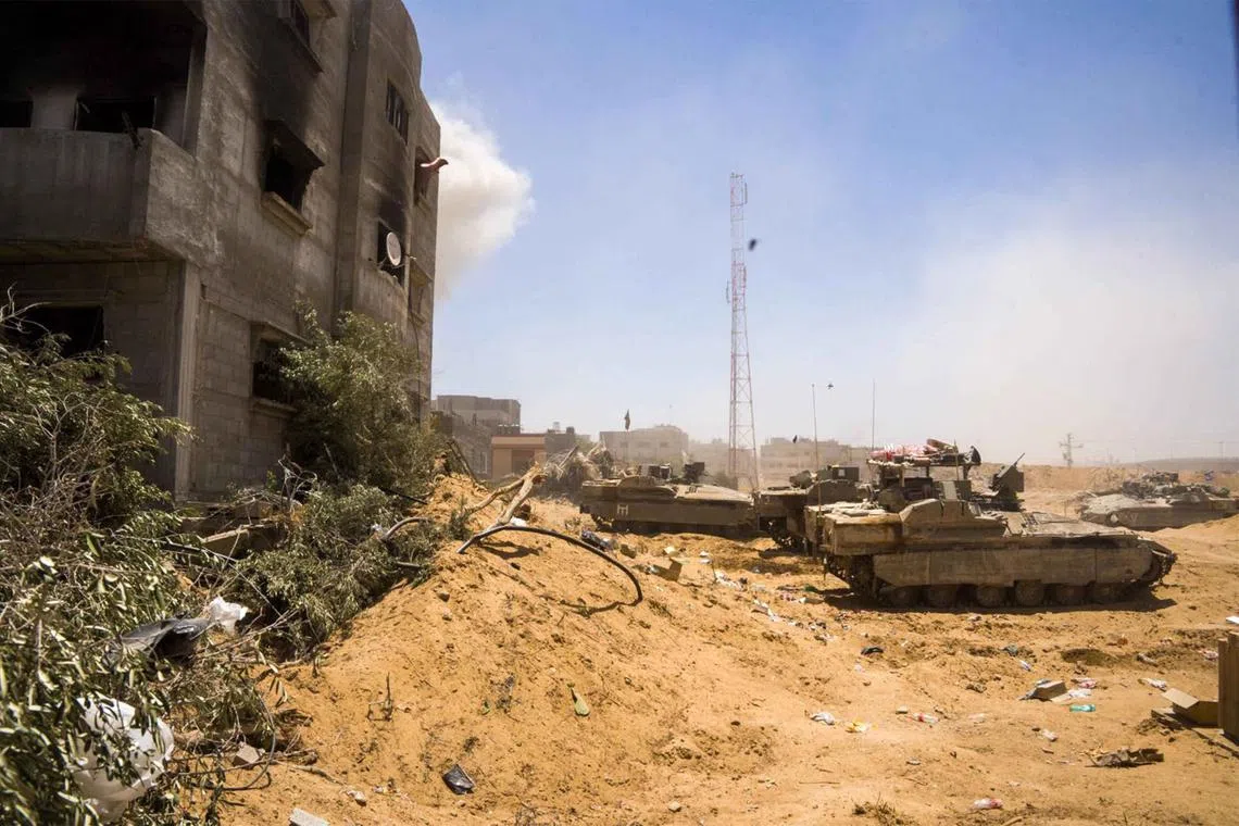 Israeli army armoured vehicles are seen operating in Rafah in the southern the Gaza Strip.