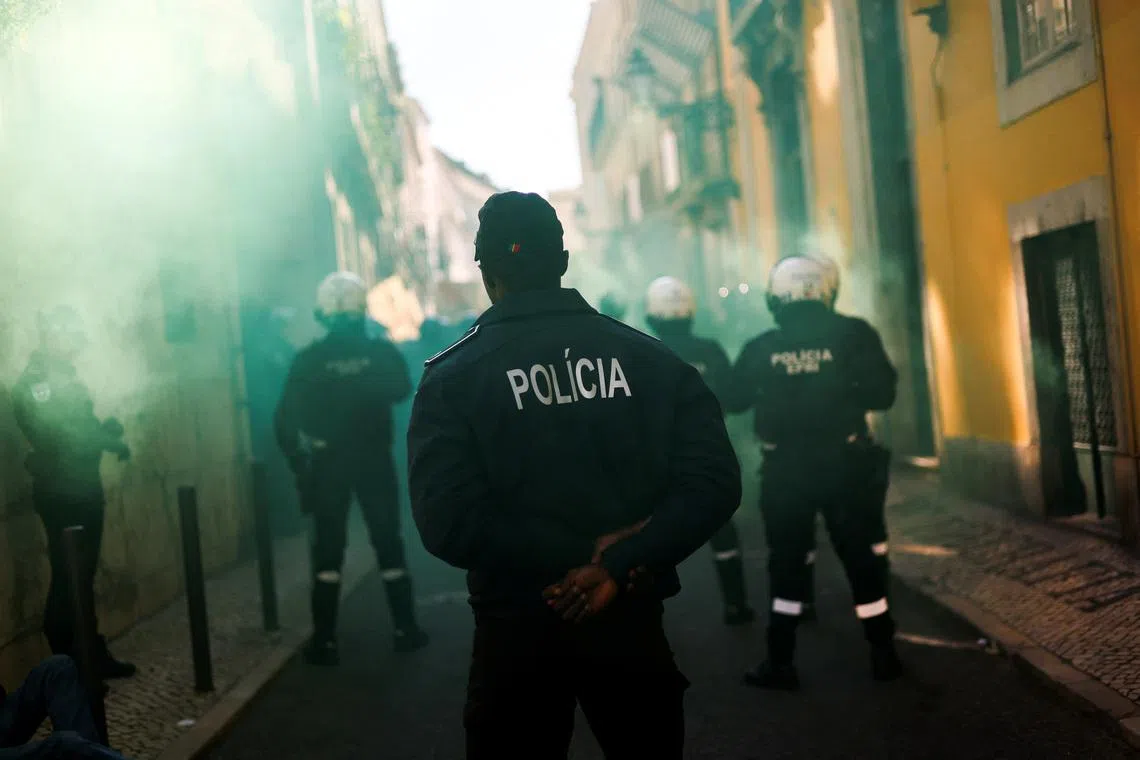 FILE PHOTO: Police officers stand guard during a protest in Lisbon, Portugal, November 24, 2023. REUTERS/Pedro Nunes/File Photo
