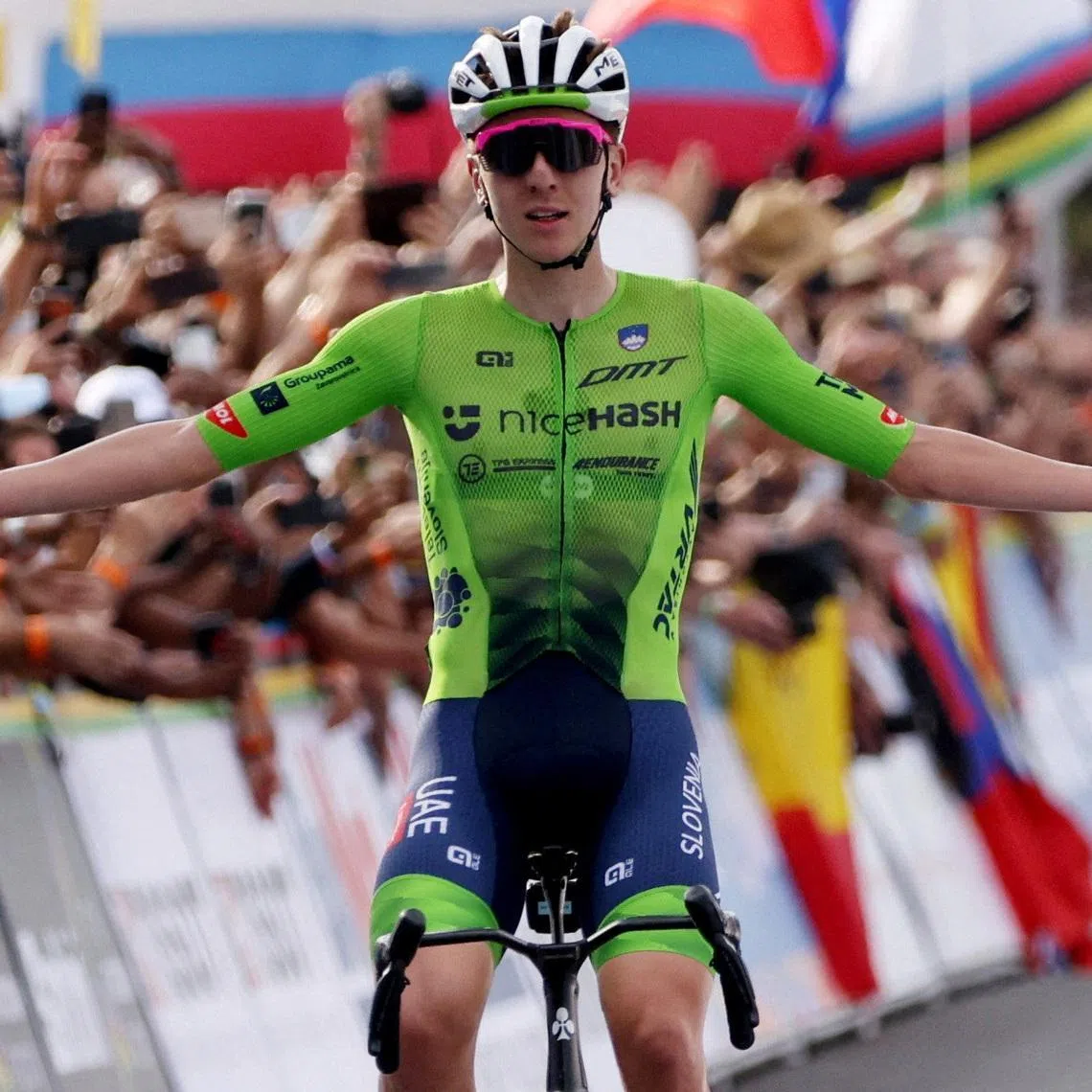 Cycling - Road World Championships 2025 - Kigali, Rwanda - September 28, 2025 Slovenia's Tadej Pogacar celebrates as he crosses the finish line to win the Men's Elite Road Race REUTERS/Jean Bizimana/File Photo