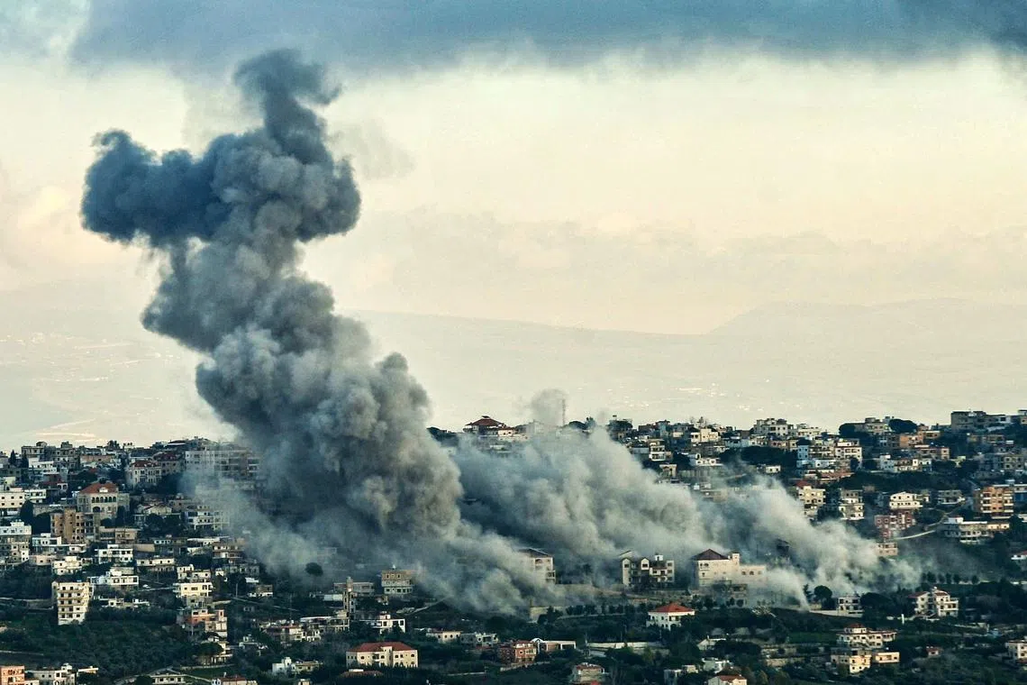 Smoke billowing over the southern Lebanese border village of El-Khiam during Israeli bombardment on Feb 7, 2024.