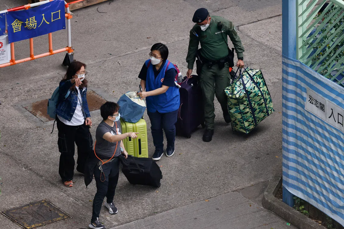 A week after Hong Kong’s deadly fire, some residents return for belongings