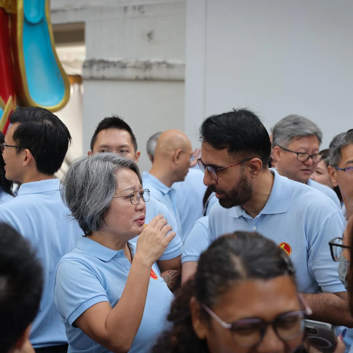 Workers' Party chairwoman Sylvia Lim (centre, left) speaking to Mr Pritam Singh at the party's community outreach event in Serangoon North on Jan 18.