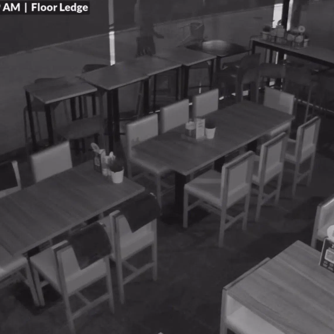 The men can be seen throwing chairs at the exterior of the store and at the hoarding barrier across the eatery.
