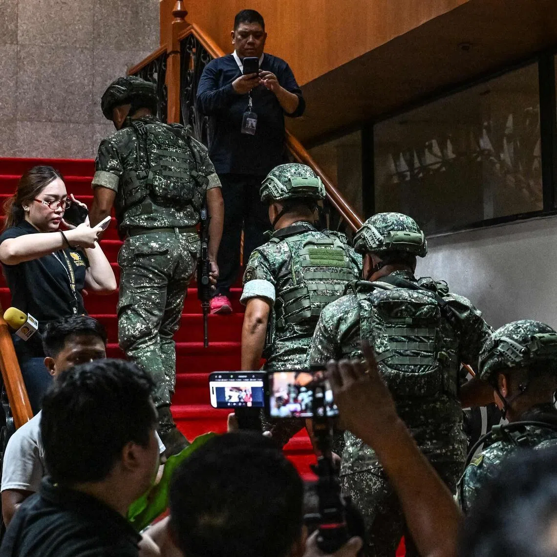 Troops arrive after the exchange of gunshots inside the Senate of the Philippines in Pasay, Metro Manila, on May 13.