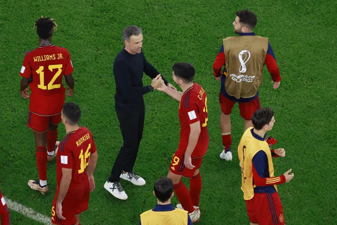 Spain coach Luis Enrique shakes hands with Carlos Soler after the 7-0 win over Costa Rica.