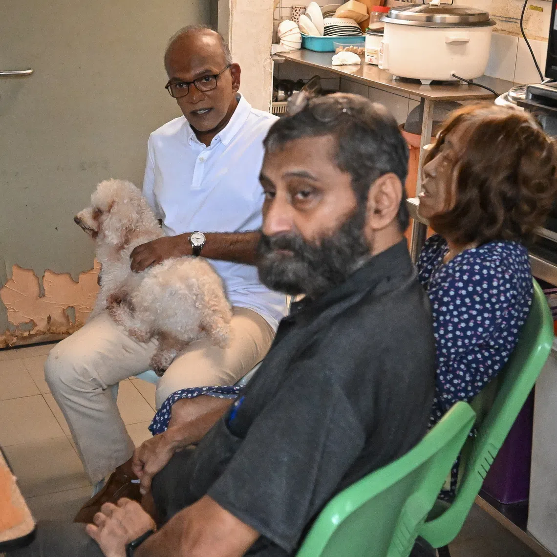 Animal Lovers League co-founders Mohan Div (in black shirt) and Cathy Strong with Minister for Home Affairs and Coordinating Minister for National Security K. Shanmugam on Dec 10.