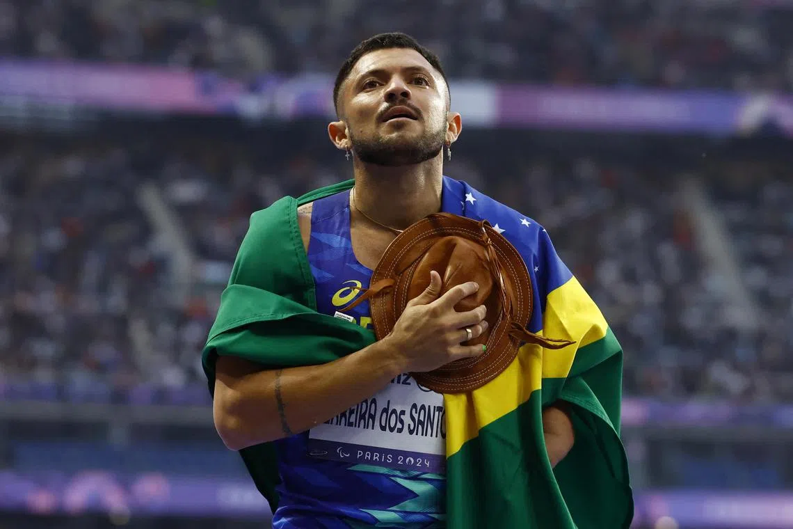 Paris 2024 Paralympics - Athletics - Men's 100m - T47 Final - Stade de France, Saint-Denis, France - August 30, 2024
Petrucio Ferreira dos Santos of Brazil celebrates winning gold after the final REUTERS/Stephanie Lecocq