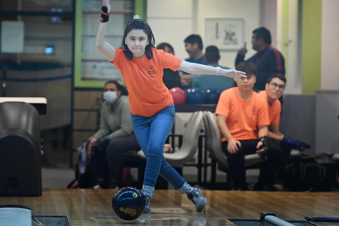 Ms Florence Hui, 23 during her bowling training organised by Special Olympics Singapore. Bowling helped Florence gain confidence when she was bullied in school. She has an intellectual disability. 