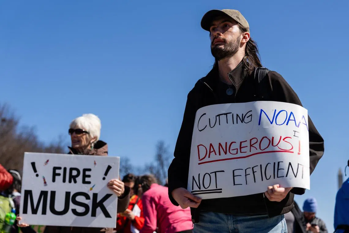 Attendees at a Stand Up for Science rally in Washington on March 7, amid planned job cuts at the National Oceanic and Atmospheric Administration, the nation’s premier agency for weather and climate science.