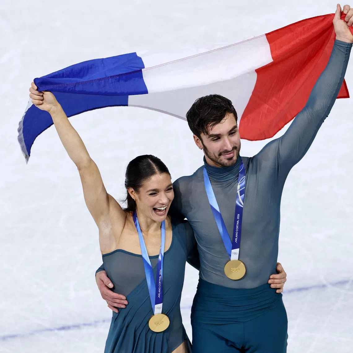 Milano Cortina 2026 Olympics - Figure Skating - Ice Dance - Victory Ceremony - Milano Ice Skating Arena, Milan, Italy - February 11, 2026. Gold medallists Laurence Fournier Beaudry of France and Guillaume Cizeron of France celebrate during the Ice Dance Victory Ceremony. REUTERS/Amanda Perobelli