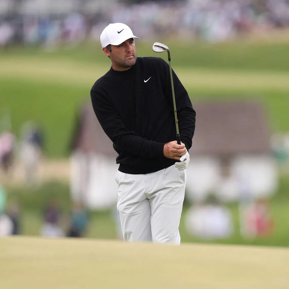 Scottie Scheffler chipping onto the ninth green during the second round of the PGA Championship on May 15.