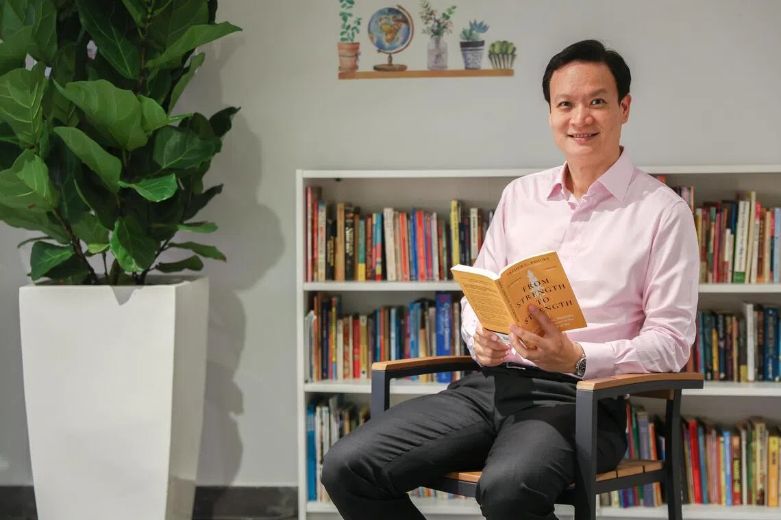 Joe Hau, chief executive officer of Woodlands Hospital, in Woodlands Hospital on July 8. He is currently reading From Strength To Strength by Arthur C. Brooks.
