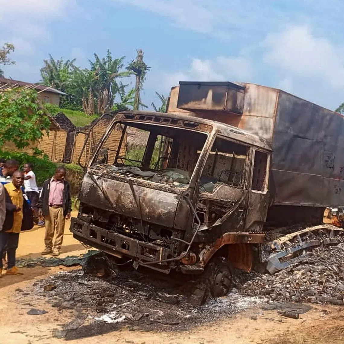 A charred wreckage of a truck stands on a road after it was burnt following an attack by Islamic State-affiliated Allied Democratic Forces (ADF) rebels, in the town of Ntoyo in North Kivu province's Lubero territory, eastern Democratic Republic of Congo September 9, 2025. REUTERS/Stringer