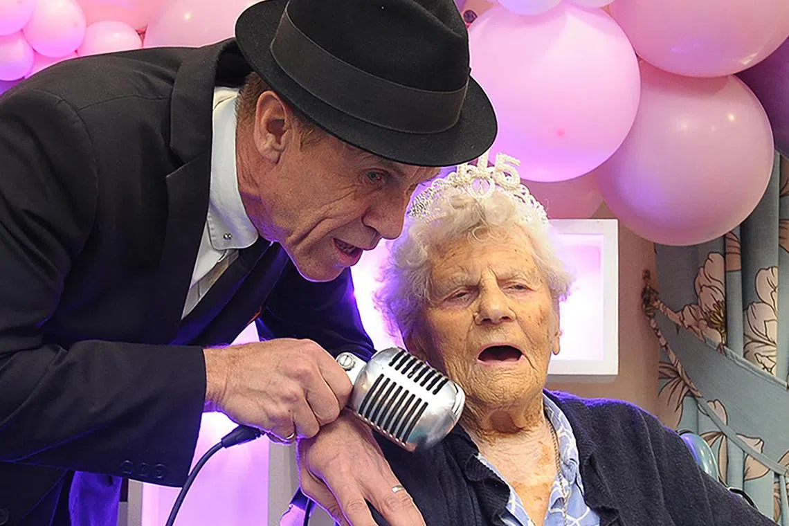 Ms Ethel Caterham celebrating her 115th birthday in Lightwater, south west of London, in 2024.