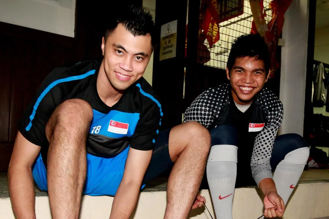Former national goalkeeper Lionel Lewis (left) during his playing days with then up-and-coming goalkeeper Izwan Mahbud.