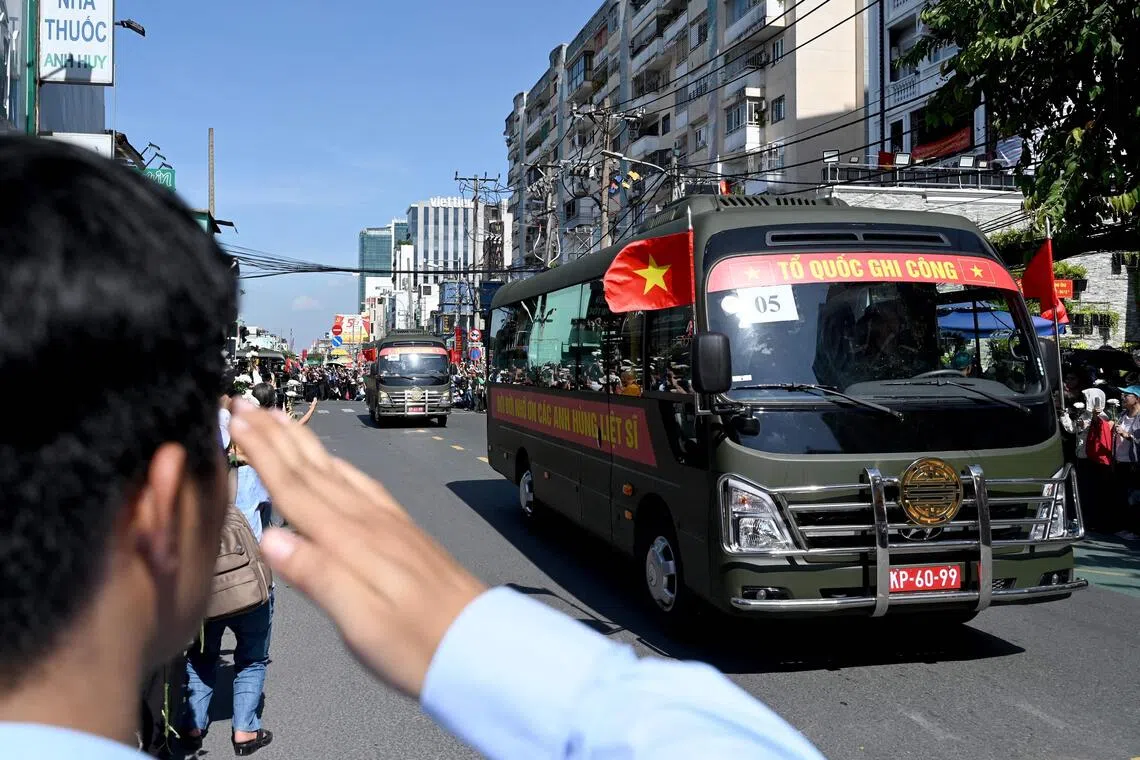 A bus carrying caskets containing the remains of fallen soldiers in Ho Chi Minh City on Oct 14.