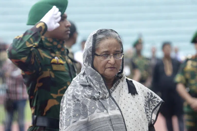 Bangladesh's ousted prime minister Sheikh Hasina (centre) was said to have approved a massacre that saw dozens of senior officers killed in 2009. 