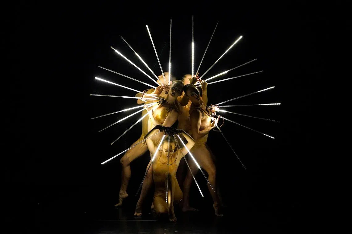 MOMIX dancers performing a scene from “Light Reigns” during a performance of Back to MOMIX at the Queens Theatre in New York on April 23, 2023. 