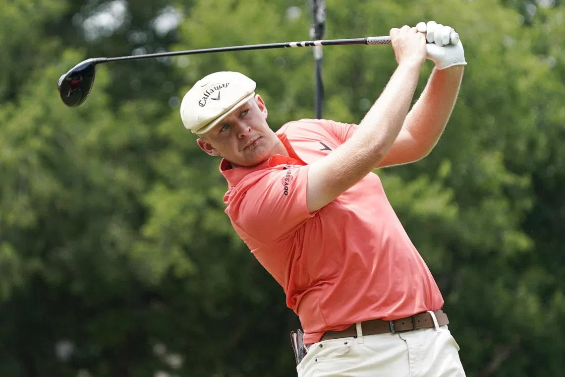 Harry Hall plays his shot from the 18th tee during the first round of the Charles Schwab Challenge.