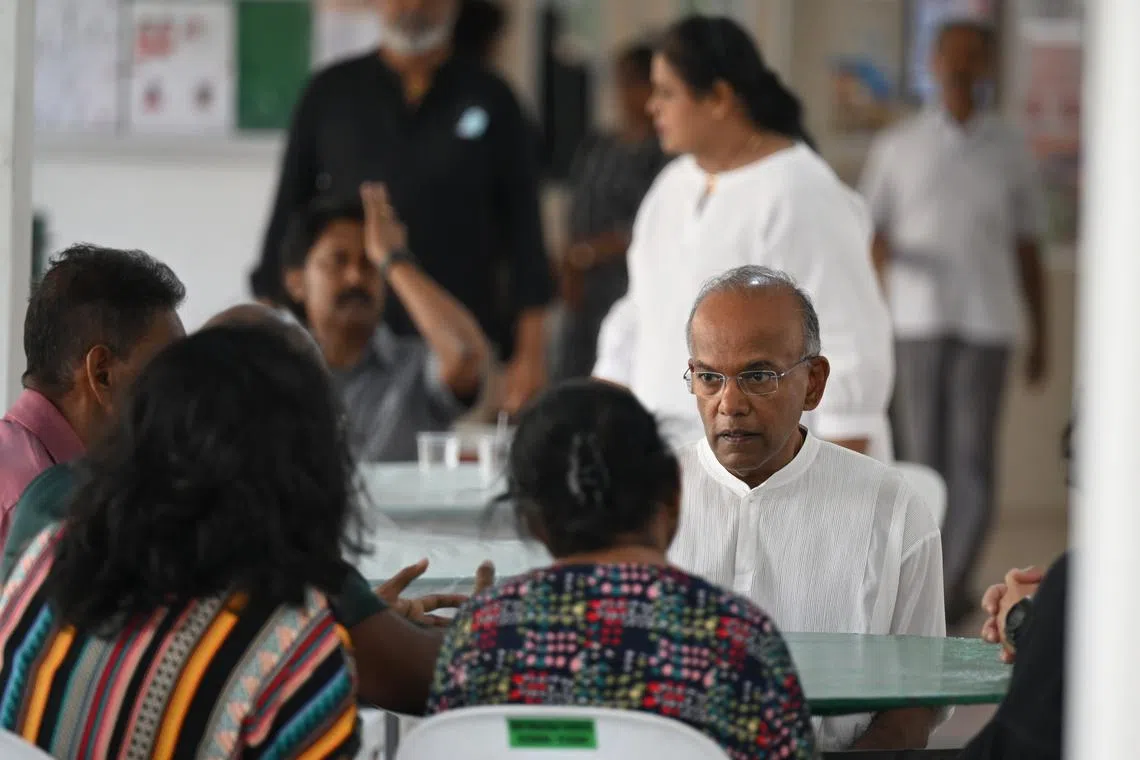 Home Affairs and Law Minister K. Shanmugam visits the wake of Sergeant Uvaraja Gopal on Sunday.