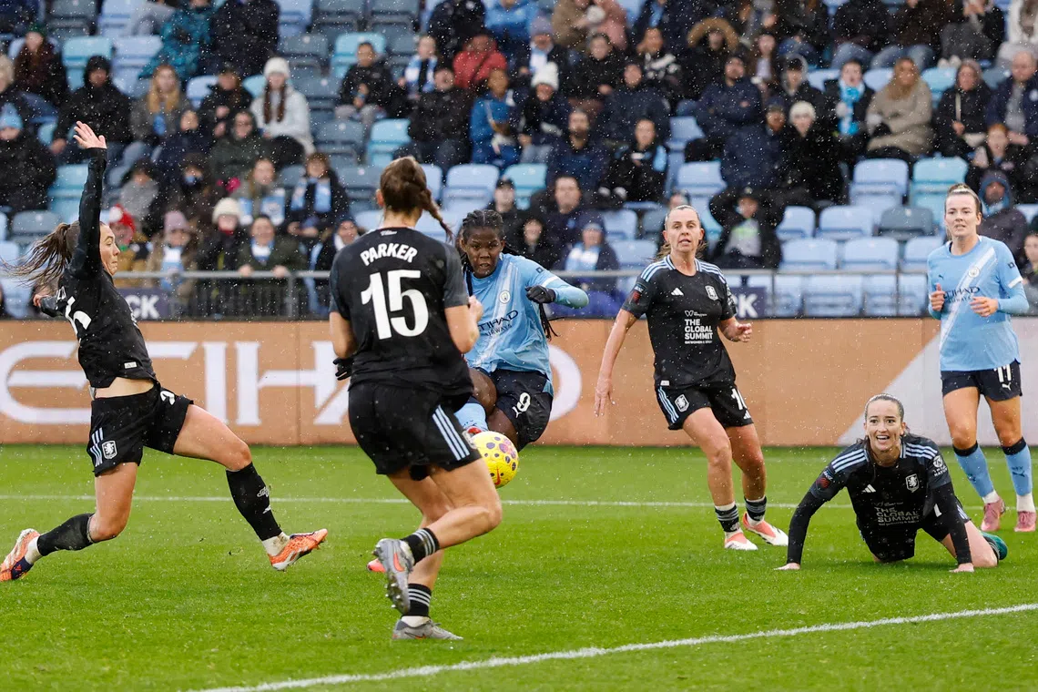 Soccer Football - Women's Super League - Manchester City v Aston Villa - Manchester City Academy Stadium, Manchester, Britain - December 14, 2025 Manchester City's Khadija Shaw scores their second goal Action Images via Reuters/Jason Cairnduff