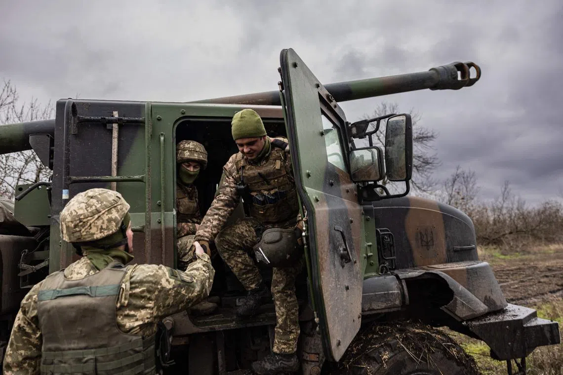 Ukrainian servicemen prepare to fire with a Caesar self-propelled howitzer towards Russian positions in eastern Ukraine, on Dec 28, 2022.