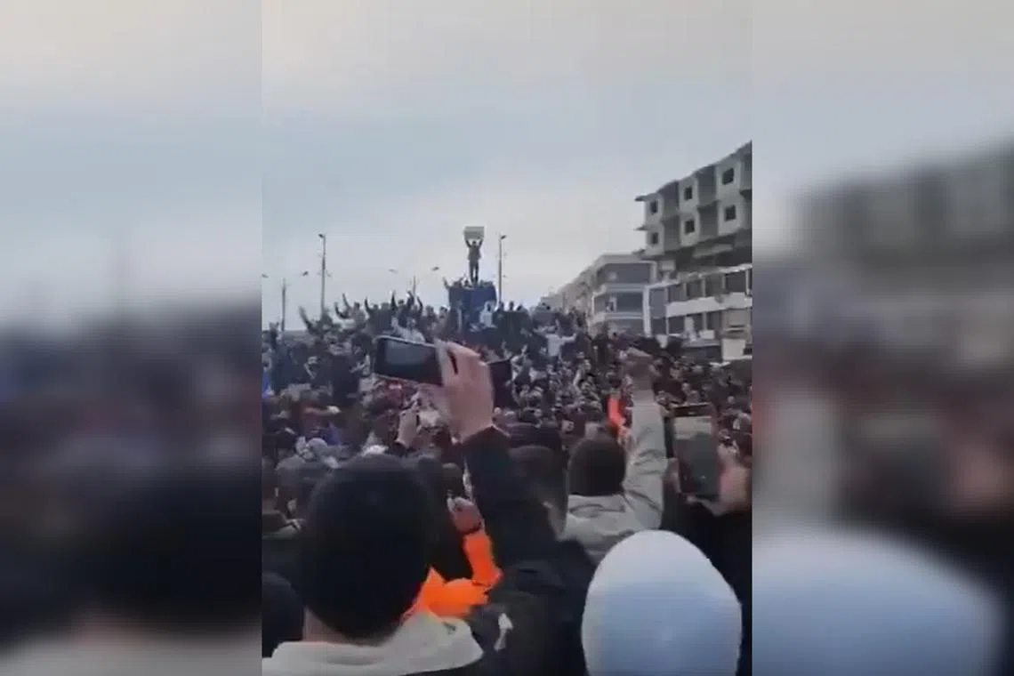 A screen grab from social media said to show a protest in the Syrian city of Homs, where a curfew was later imposed by police.