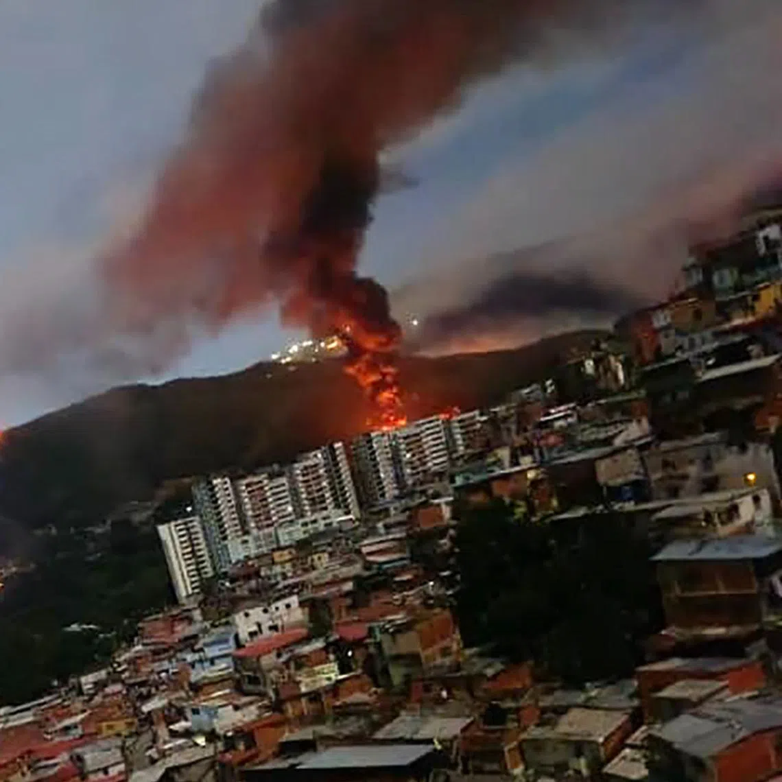 A fire at Fuerte Tiuna, Venezuela's largest military complex, after a series of explosions in Caracas during a US military operation on Jan 3.