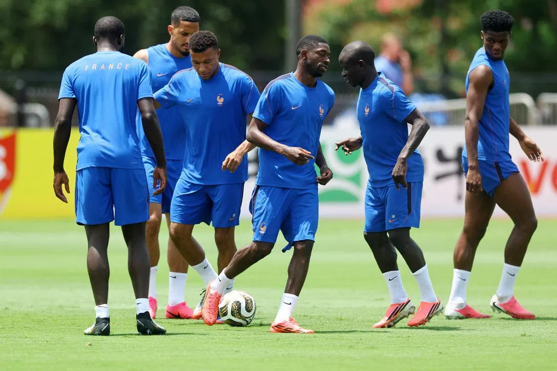 Soccer Football - FIFA World Cup 2026 - France Training - Southern Methodist University, Dallas, Texas, U.S. - July 13, 2026 France's William Saliba, Kylian Mbappe, Ousmane Dembele, Ngolo Kante and Aurelien Tchouameni during training REUTERS/Kai Pfaffenbach