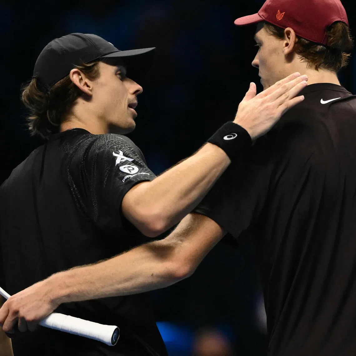 Italy's Jannik Sinner (right) interacting with Australia's Alex de Minaur after winning their semi-final at the ATP Finals tennis tournament in Turin on Nov 15, 2025. De Minaur also lost to Carlos Alcaraz of Spain earlier in the tournament.
