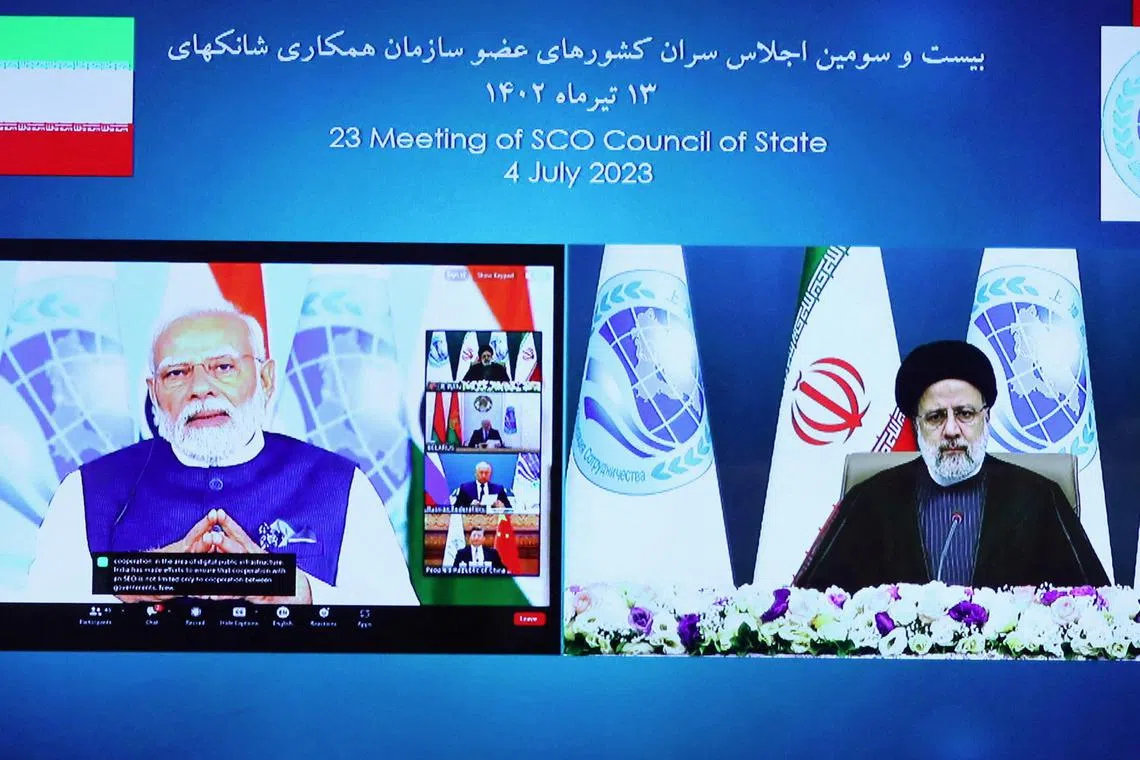 Indian Prime Minister Narendra Modi (left) and Iranian President Ebrahim Raisi attend the 23rd Shanghai Cooperation Organisation leaders' summit via video link, on July 4.