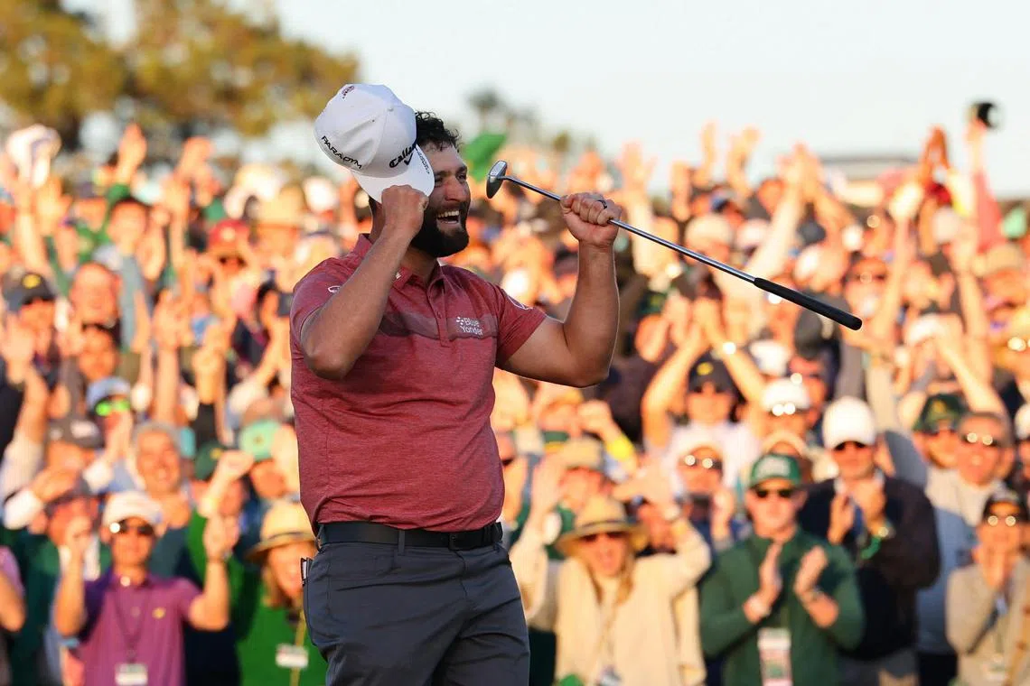 Jon Rahm celebrates on the 18th green after winning the Masters at Augusta National on Sunday.  