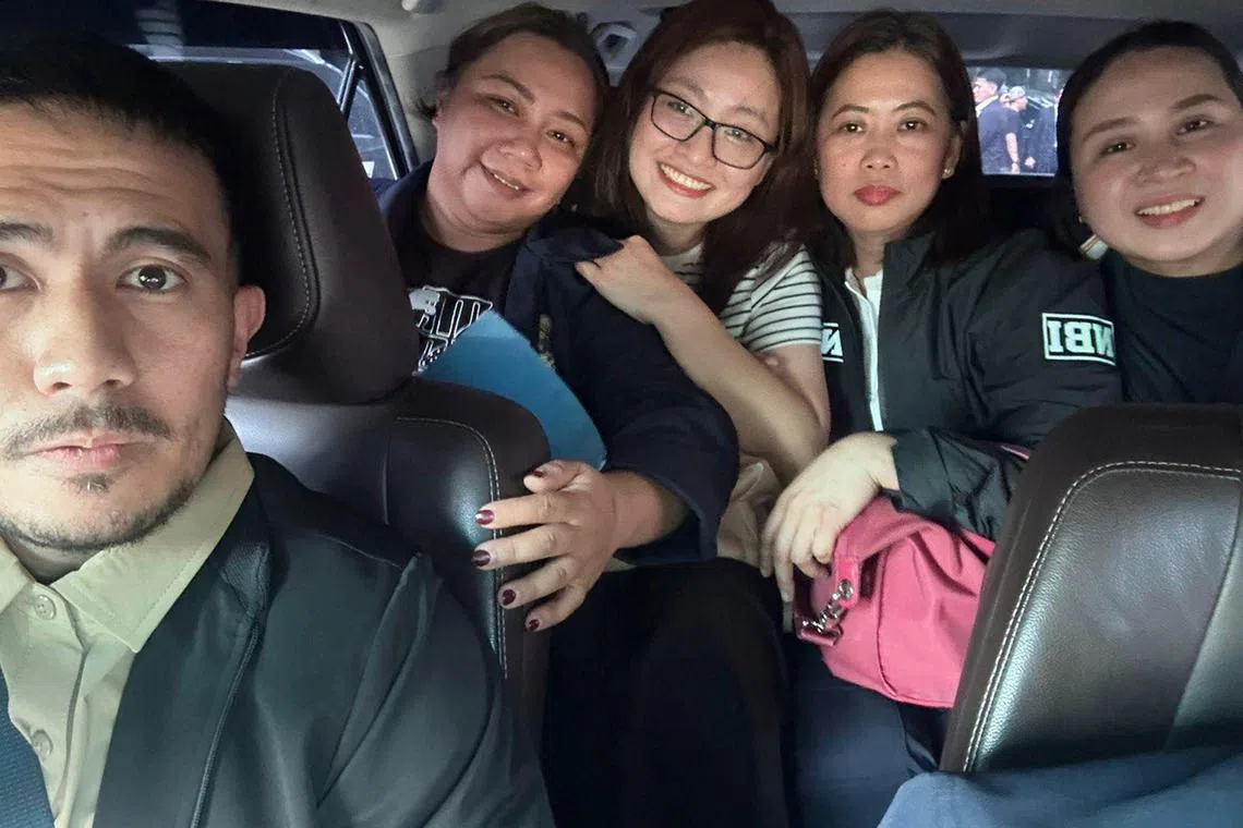 Filipino social media users are furious over a group photo taken by an NBI agent inside a car taking fugitive ex-mayor Alice Guo (in striped outfit) to Jakarta's airport on Sept 5 for deportation. 