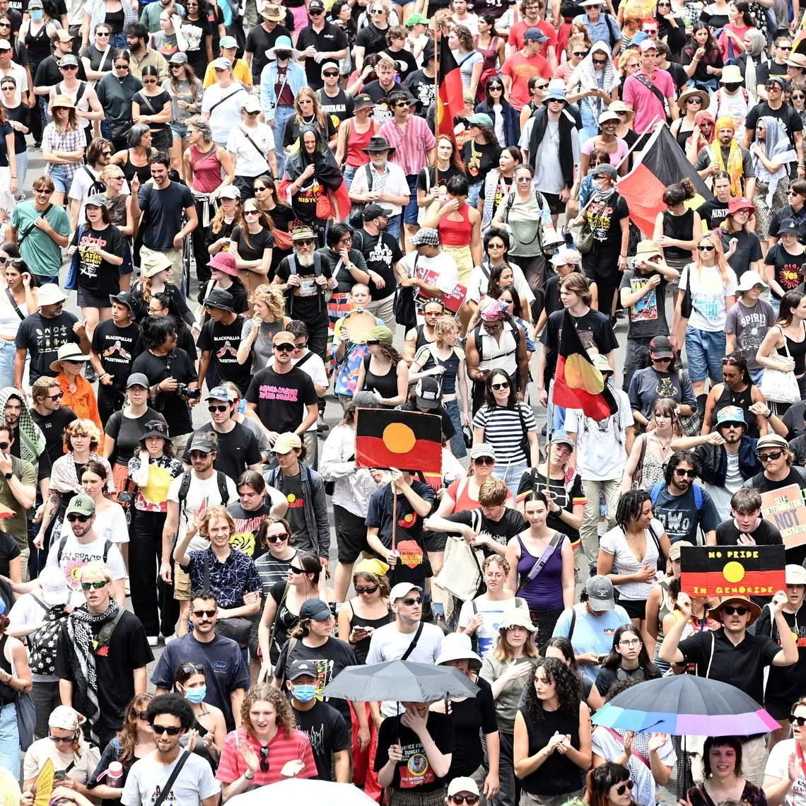 People take part in the Invasion Day protest march through Sydney during Australia Day 2026 celebrations, Australia, January 26, 2026. REUTERS/Jeremy Piper
