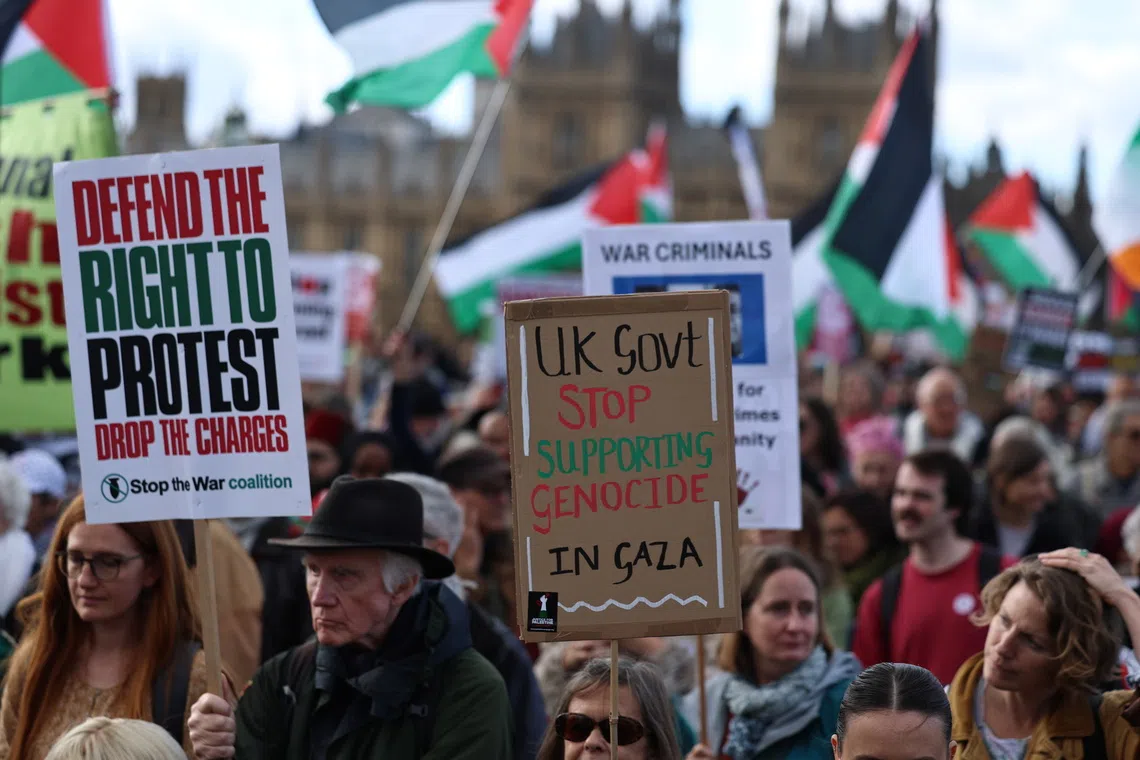 Protesters take part in the National March for Palestine, organised by the Palestine Coalition in London, Britain, on Oct 10.