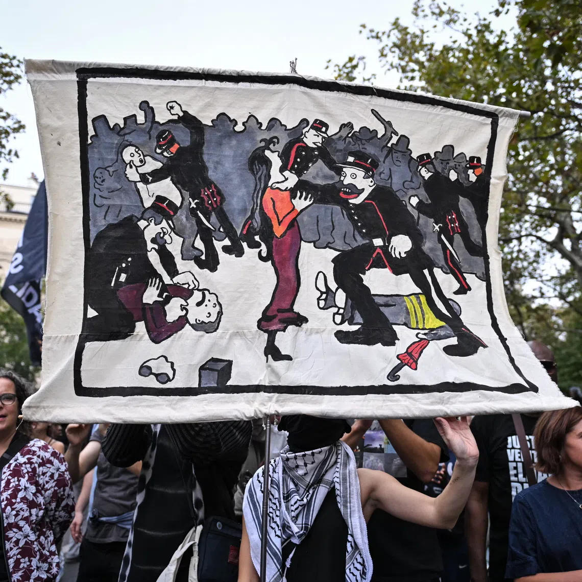 Protesters in a national march on Sept 20 against proposed legislation on the legitimate use of firearms by law enforcement, in Paris, France.