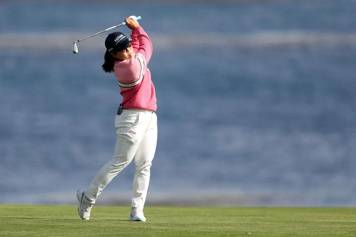 Nasa Hataoka of Japan playing an approach shot on the 18th hole during the third round of the 78th US Women's Open at Pebble Beach Golf Links on Saturday. She fired a stunning six-under 66 to stand on seven-under 209 after 54 holes.