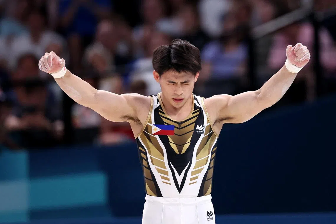 Paris 2024 Olympics - Artistic Gymnastics - Men's All-Around Final - Bercy Arena, Paris, France - July 31, 2024.
Carlos Edriel Yulo of Philippines reacts after performing on the Parallel Bars. REUTERS/Amanda Perobelli