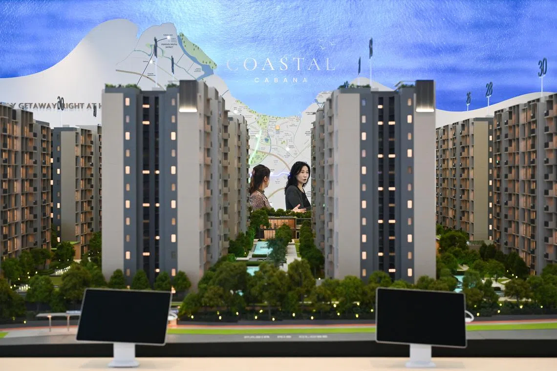 People inside the Coastal Cabana executive condominium showflat, that still has the current measures, at Eunos Avenue 3 on May 8.