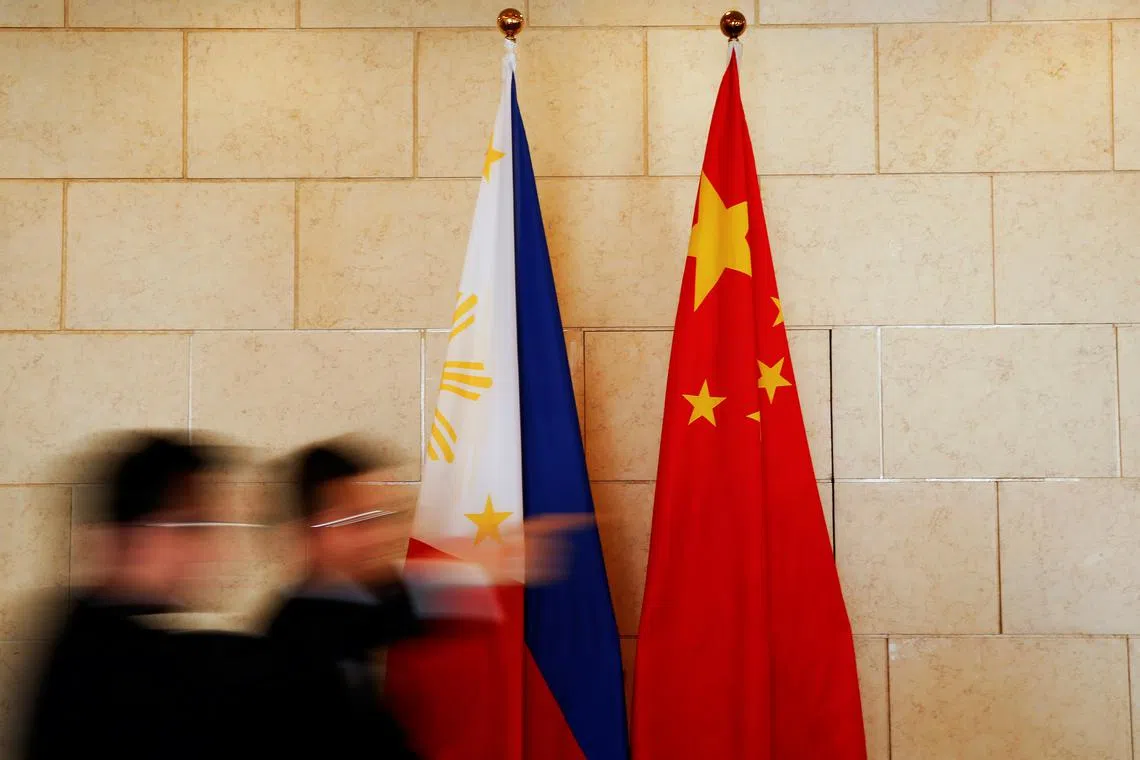 FILE PHOTO: National flags are placed outside a room where Philippine Finance Secretary Carlos Dominguez and China's Commerce Minister Gao Hucheng address reporters after their meeting in Beijing, China, January 23, 2017. REUTERS/Damir Sagolj/File Photo