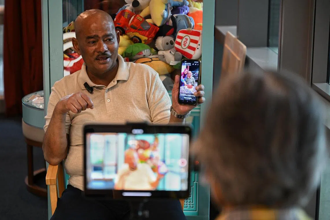 Mr Akbar Abdul Kader recording his legacy video at Oasis @ Outram day hospice on Dec 28, 2023.
In Singapore, where death and dying are still rarely discussed, a small group of patients are making legacy videos for their families. Senior digital ambassadors from non-profit orgn Wings have been producing such videos for patients at the end of their lives, including those from the day hospice Oasis@Outram.