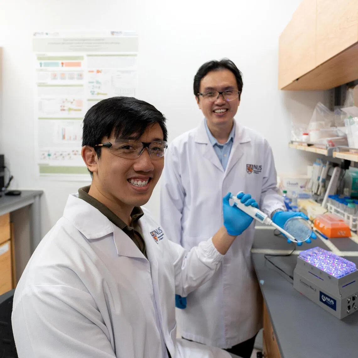 NUS College of Design and Engineering PhD student Linus Tan (left), lead author of the study, with Poh Chueh Loo, an associate professor from NUS Synthetic Biology for Clinical and Technological Innovation who led the research.