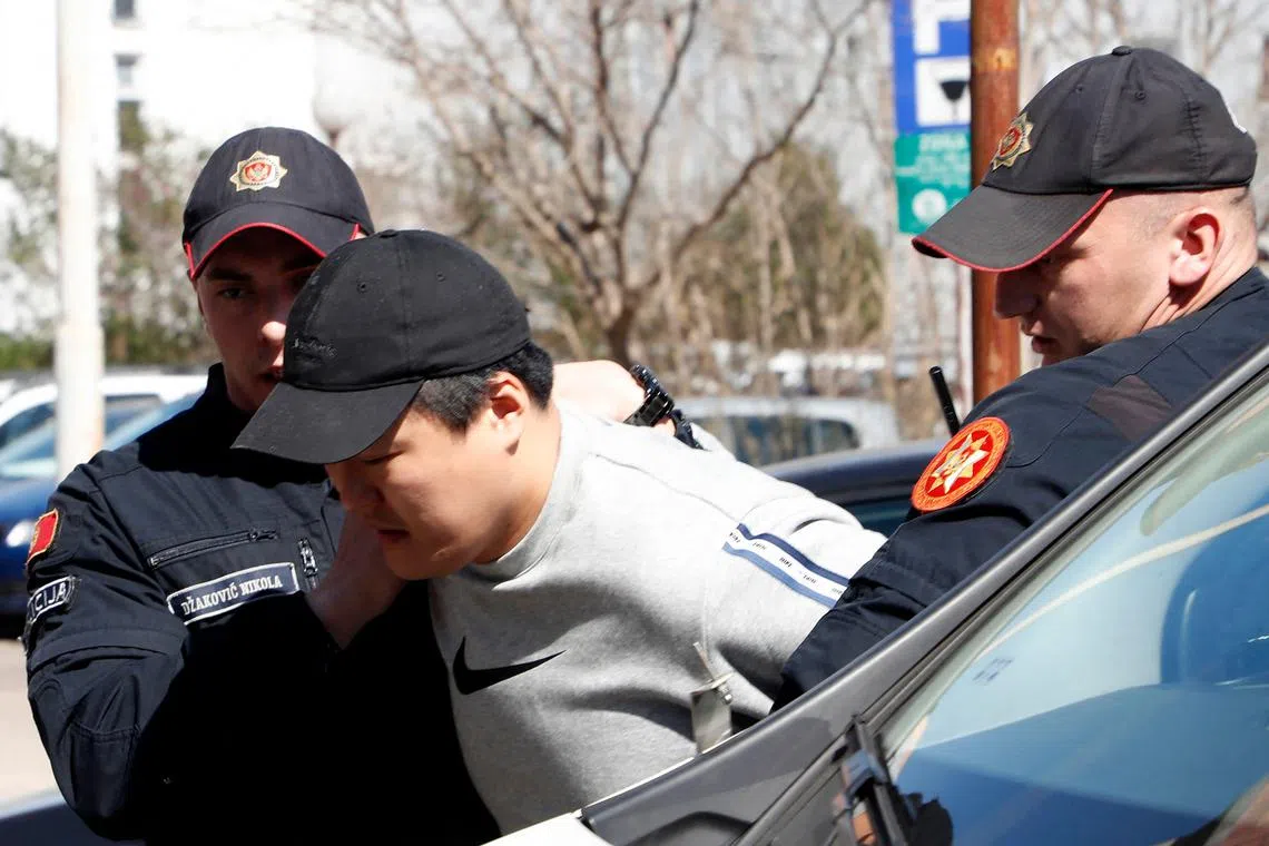 (FILES) In this file photo taken on March 24, 2023 South Korean cryptocurrency entrepreneur co-founder of Terraform Labs (Terra Luna), Do Kwon (C) is taken to court after being arrested at the airport in Podgorica. - The United States and South Korea have sought the extradition from Montenegro of fugitive cryptocurrency entrepreneur Do Kwon, the country's minister of justice said on March 29, 2023. (Photo by STRINGER / AFP)