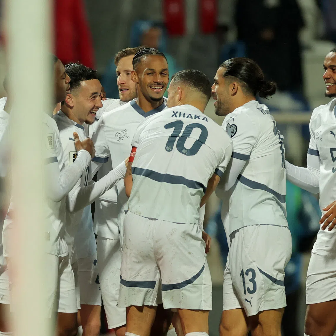 Soccer Football - FIFA World Cup - UEFA Qualifiers - Group B - Kosovo v Switzerland - Fadil Vokrri Stadium, Pristina, Kosovo - November 18, 2025 Switzerland's Ruben Vargas celebrates scoring their first goal with teammates REUTERS/Valdrin Xhemaj