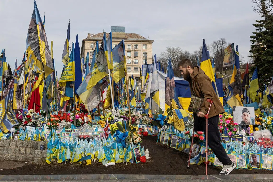 A war veteran visiting a makeshift memorial for fallen Ukrainian soldiers on March 5, on Independence Square in Kyiv, Ukraine.